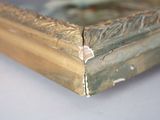 a close up of a picture of a gold frame