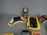 a lot of electronic toys that are on a table