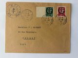 an old envelope with stamps and stamps on it sitting on a table
