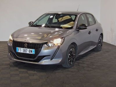 a picture of a silver car parked in a showroom