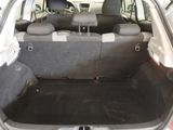 a trunk of a car with the back seats folded down