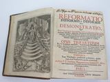an open book with a picture of a statue on top of it