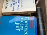 two books in a cardboard box on top of a table