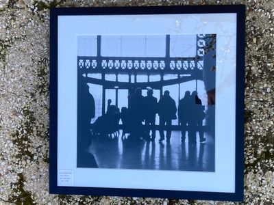 a picture of a group of people sitting on a bench