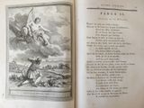 an open book with a picture of an angel on it