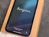 an iphone is sitting on top of a box on a table