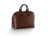 un sac à main en cuir marron posé sur une surface blanche