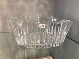 a glass bowl that is sitting on a table