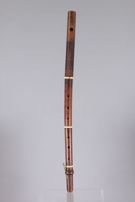a flute that is sitting on top of a glass