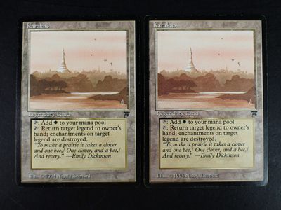 these are two cards with a picture of a city in the background