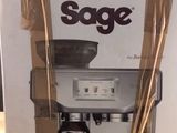 a box with a coffee machine inside of it on a shelf
