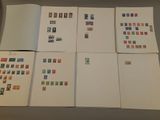 many different types of stamps displayed on a table