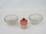 three small glass bowls sitting next to each other on a table