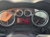 a close up of a car dashboard with a clock on it