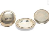 two silver plated dishes and a bowl on a white surface