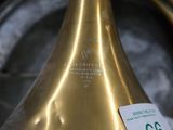 a close up of a brass colored lamp with a price tag on it