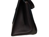 a black purse with a zipper on the inside of it