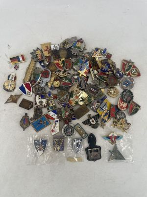 a pile of pins and other items on a table