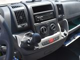 a dashboard of a truck with a radio and a steering wheel