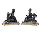pair of bronze figurines of a woman and a dog on marble bases
