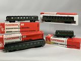 several model trains are stacked on top of each other on display