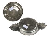pair of antique pewware dishes with labels on them