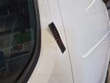 a sticker on the side of a car that has a remote control attached to it
