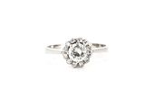 a close up of a diamond ring on a white background