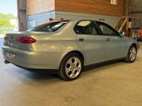 a picture of a car in a garage with a price tag on the back of the car