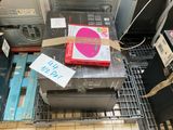 a pile of electronics on the floor in a store
