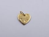 gold plated heart shaped charm with the word love written on it