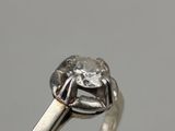 a close up of a ring with a diamond on it