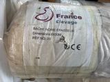 a roll of bread wrapped in plastic wrap on a table