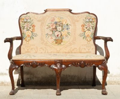 a wooden bench with a floral design on it