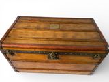 an old wooden chest with metal studding and a lock