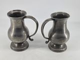 pair of antique silverplated pewware vases on pedestals