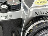 a close up of a camera with a lens attached to it
