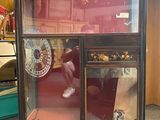 a display case with a clock inside of it