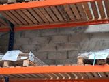 many pallets that are stacked on the shelves in the warehouse
