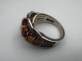 a close up of a ring on a white surface