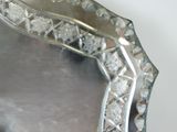 a silver plate with a decorative design on it