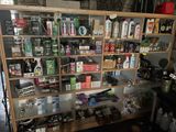 a shelf with many different items on it in a room