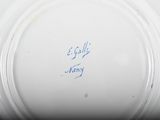 a close up of a plate with writing on it