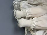 a close up of a pair of white socks with lace on them