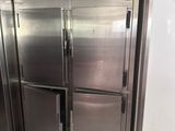 stainless steel refrigerators in a commercial kitchen with tile flooring