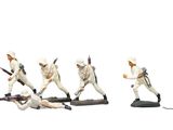 several figurines of men in white uniforms are lined up in a line
