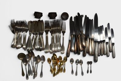 many different types of silverware on the table
