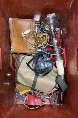 a brown box filled with assorted items in it