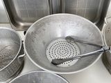 many pots and pans sitting on the stove