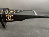 a close up of a pair of sunglasses on a table